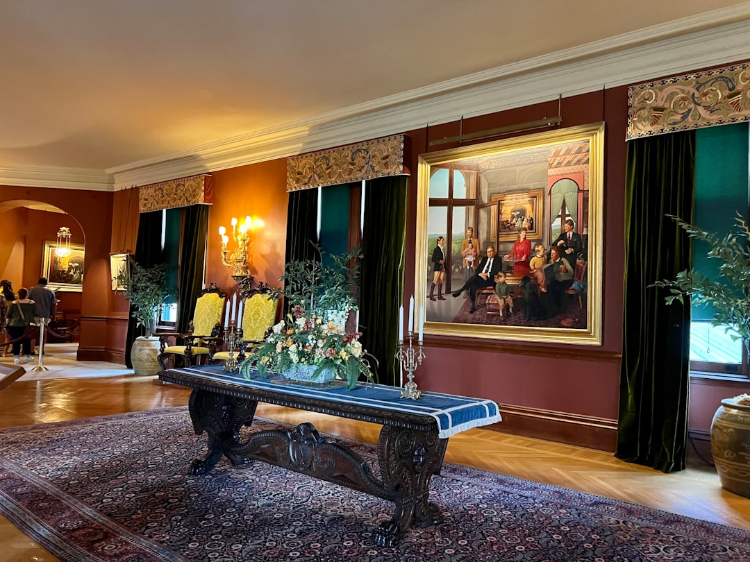 a room with a bench and paintings on the walls