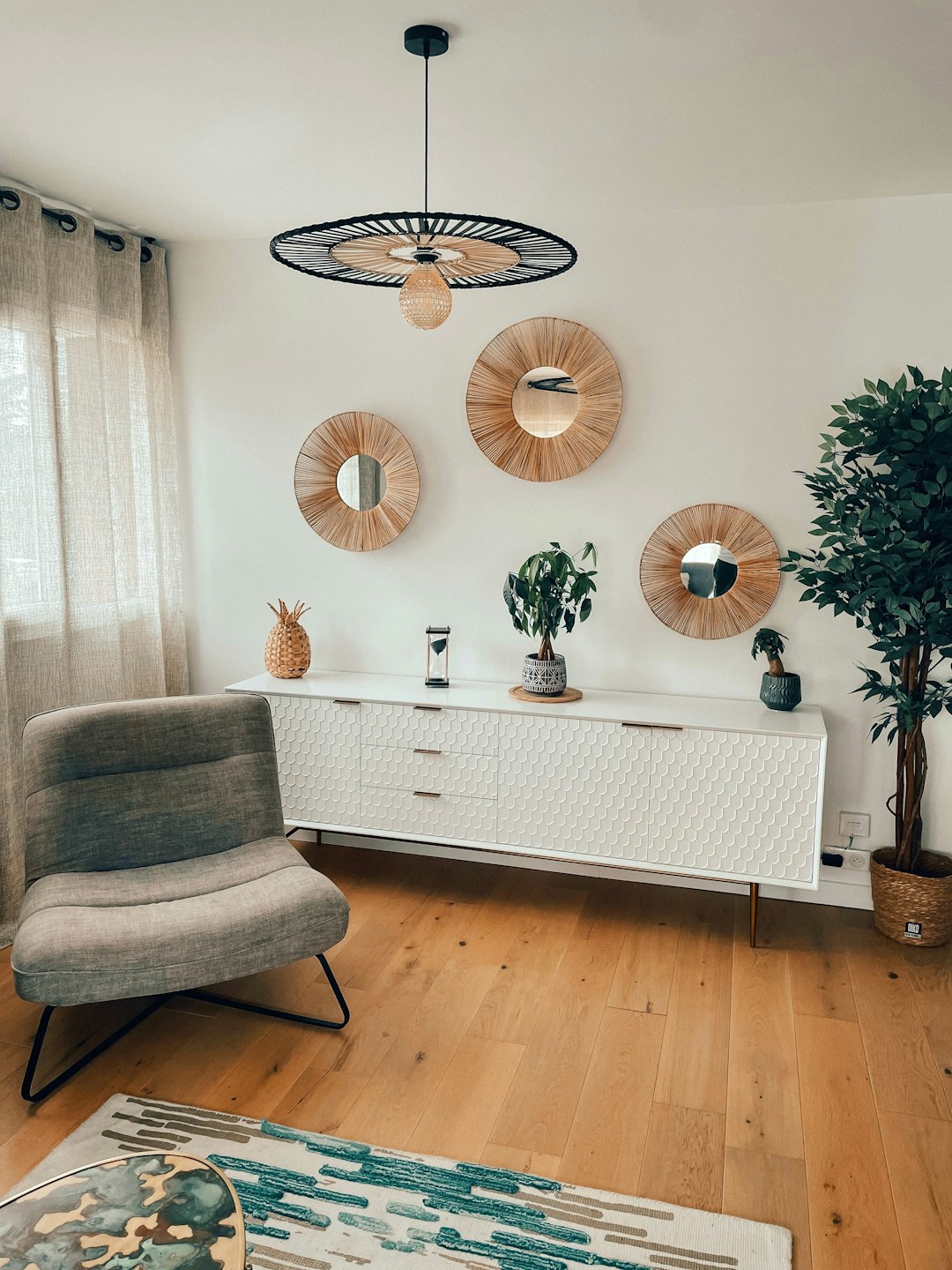 a room with a white table and chairs and a chandelier